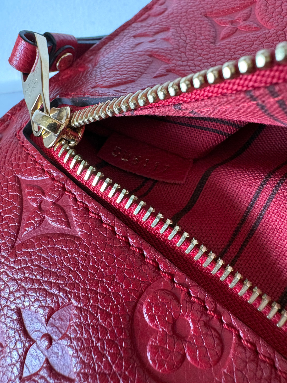 Louis Vuitton Métis Empreinte red